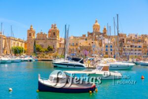 Historic Grand Harbour of Malta, focusing on the picturesque waterfront of Birgu with its traditional boats and Baroque architecture. Marina scene featuring numerous docked sailboats and motorboats