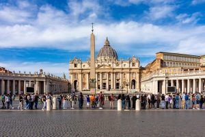Vatican - October 2022: People standing in line to visit St. Peter's Basilica on St. Peter's square, center of Rome, Italy